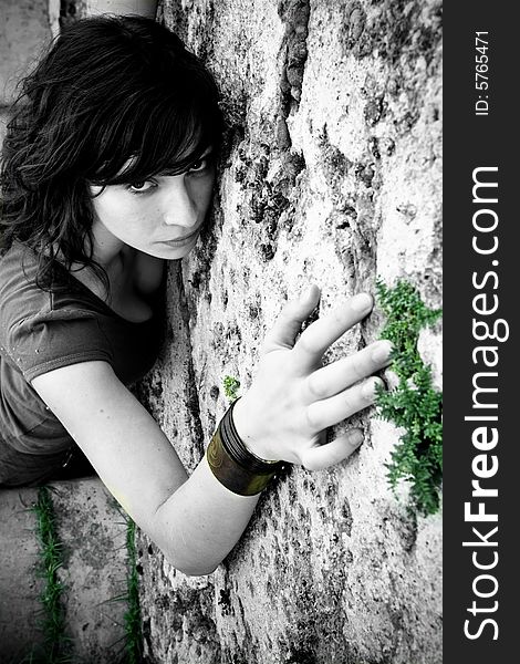 Woman on wall, monochrome with color drops