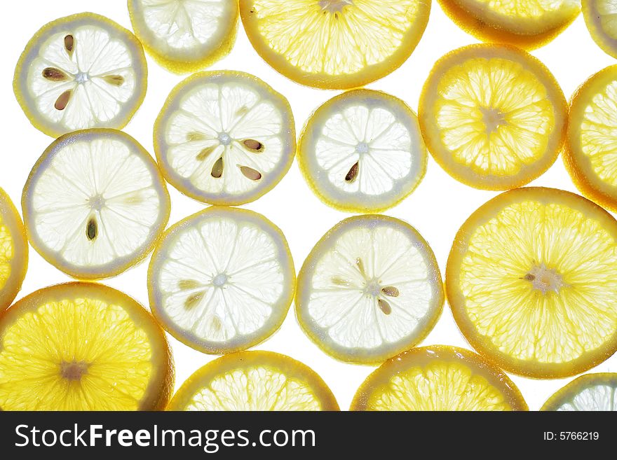 Sliced orange and lemon isolated on white background, citrus pattern.