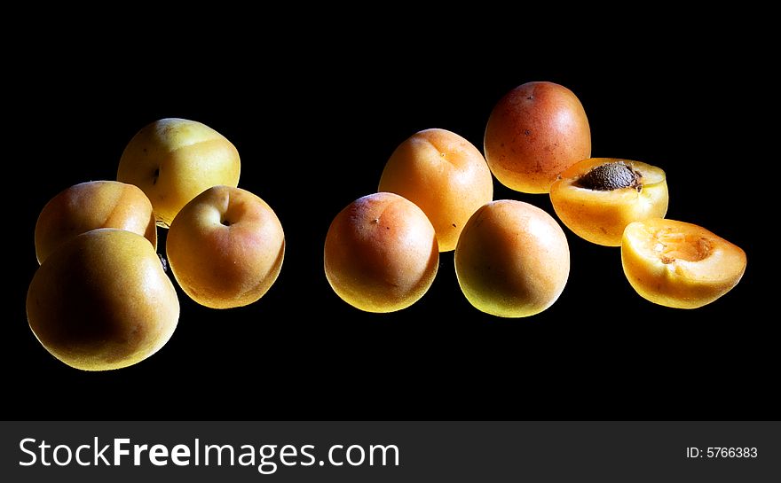 Apricots isolated on black background. Apricots isolated on black background