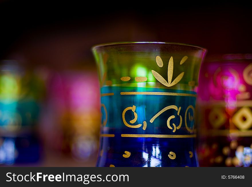 Beautifully decorated antiqye glasses with golden motifs painted on the surface. Beautifully decorated antiqye glasses with golden motifs painted on the surface