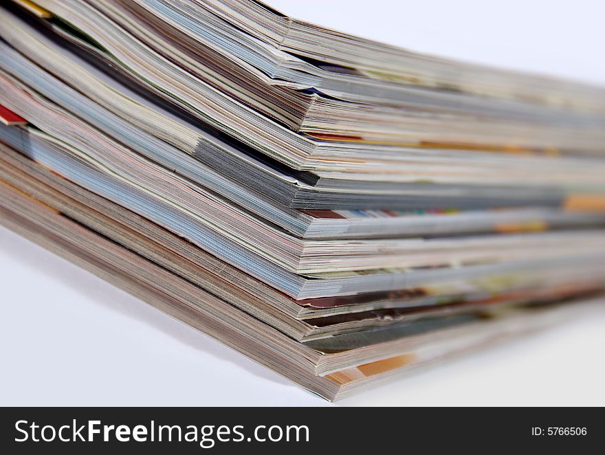 Stack of magazines isolated on white