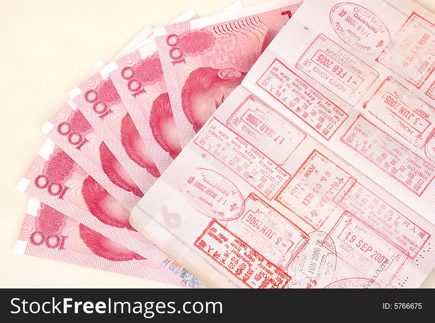 Passport with stamps and Chinese money