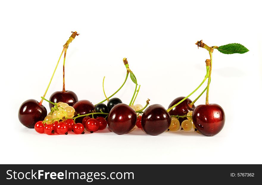 Collage of fruits and berries (horizontal row: cherry, currant, bilberry)