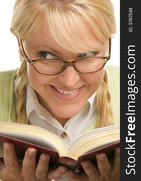 Female With Ponytails Reads Her Book isolated on a White Background. Female With Ponytails Reads Her Book isolated on a White Background.