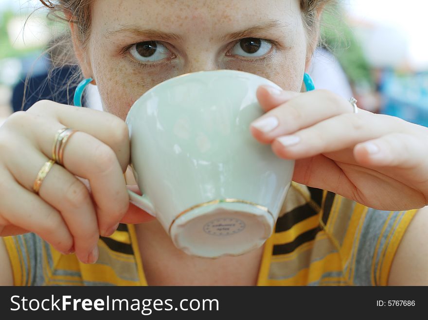 Girl drinking coffee in the cafe