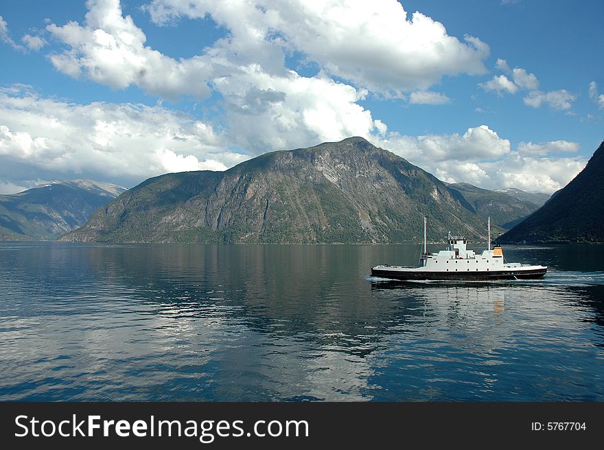 Aerial view of a ferry ship in Norway fjord.