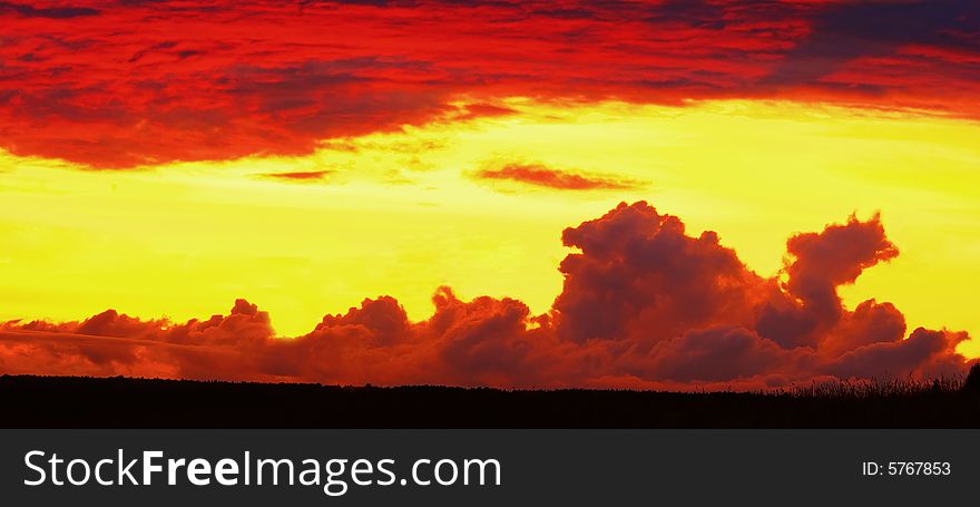 Clouds on the sunset in the form of the dragon of that lying on the earth. Illustration. Clouds on the sunset in the form of the dragon of that lying on the earth. Illustration.