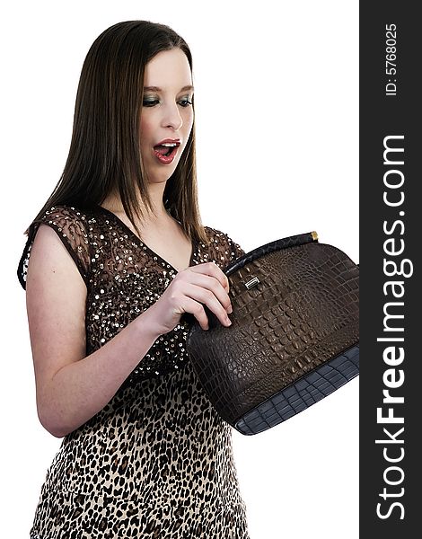 Surprised girl looking into her handbag. Surprised girl looking into her handbag
