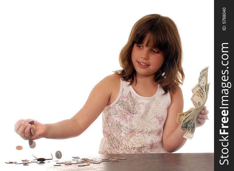 Elementary girl happily counting her money. Elementary girl happily counting her money.