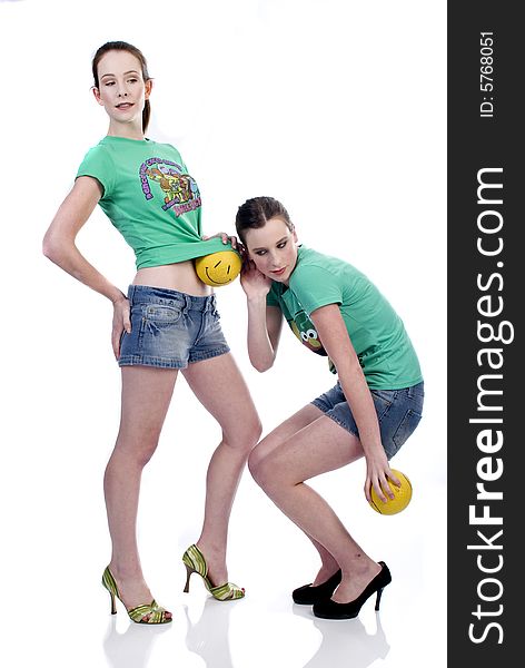 Two girls playing with balls. Two girls playing with balls