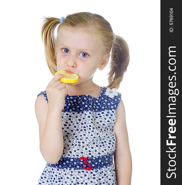 Little Cute Girl Eating Fresh Lemon