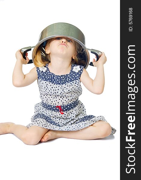 Little cute girl holding saucepan over her head, isolated