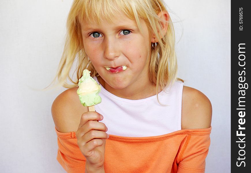 Adorable girl eating an ice cream. Adorable girl eating an ice cream