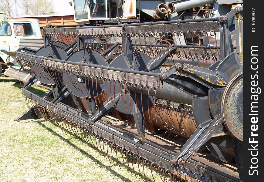 Up close angled shot of an old combine header