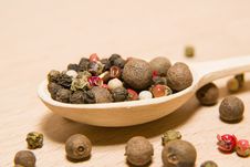 Spoon Filled With A Mixture Of Grains Of Pepper Are On A Wooden Stock Photo Spoon Filled With A Mixture Of Grains Of Pepper Are On A Wooden Stock Photo