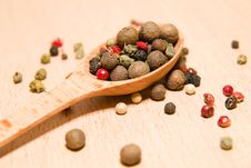 Spoon Filled With A Mixture Of Grains Of Pepper Are On A Wooden Royalty Free Stock Image Spoon Filled With A Mixture Of Grains Of Pepper Are On A Wooden Royalty Free Stock Image