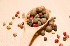 Spoon Filled With A Mixture Of Grains Of Pepper Are On A Wooden Royalty Free Stock Photography Spoon Filled With A Mixture Of Grains Of Pepper Are On A Wooden Royalty Free Stock Photography
