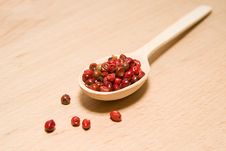 Spoon Filled With A Mixture Of Grains Of Pepper Are On A Wooden Stock Photography Spoon Filled With A Mixture Of Grains Of Pepper Are On A Wooden Stock Photography