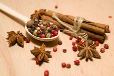Spoon With A Mixture Of Grains Of Pepper, Cinnamon And Star Anis Stock Photo Spoon With A Mixture Of Grains Of Pepper, Cinnamon And Star Anis Stock Photo