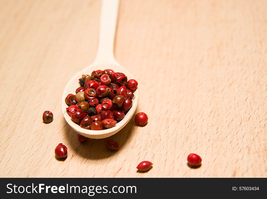 Spoon Filled With A Mixture Of Grains Of Pepper And Star Anise O