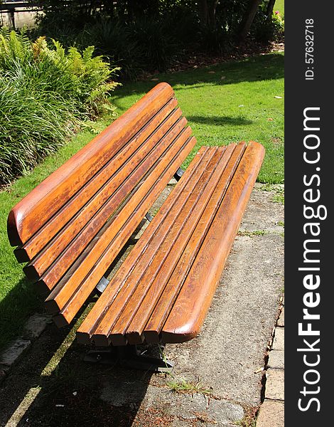 Beautiful wooden bench in riverside park in Quimper, Brittany, france