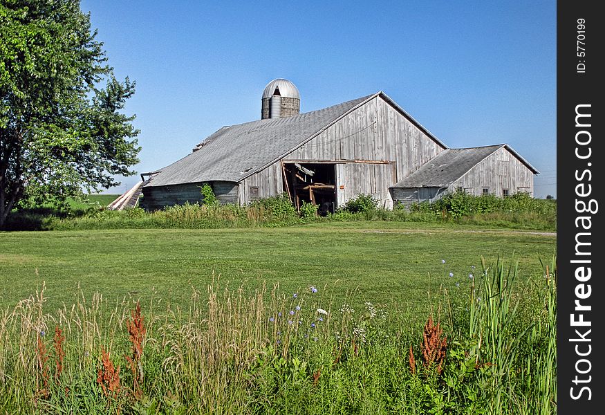 Bleached out barn on a summer morning. Bleached out barn on a summer morning.