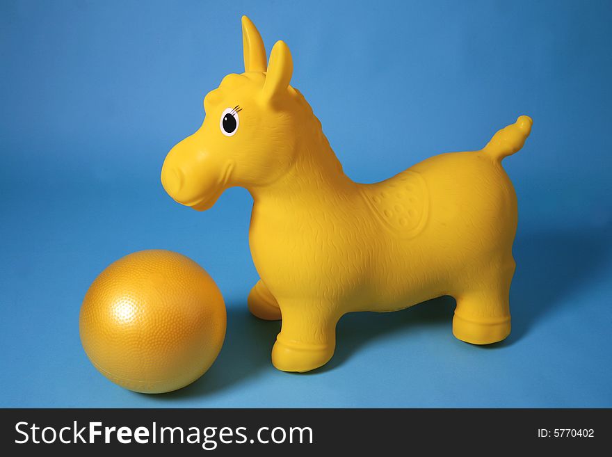 Yellow gymnastic pony with balloon