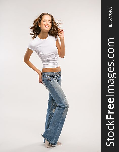 Smiling Young Girl In Jeans