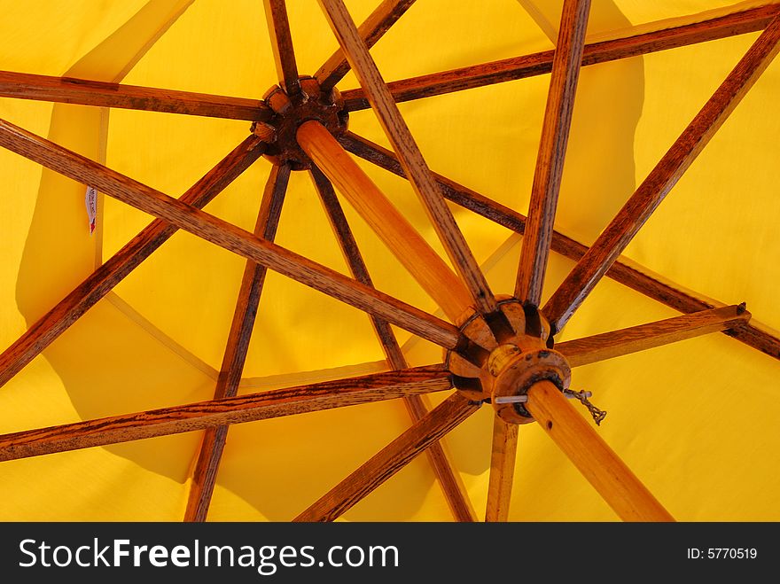 A bright yellow umbrella under the florida sun.