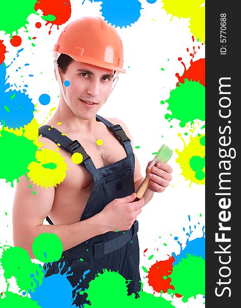 Muscular young man in a builder uniform with tools. Muscular young man in a builder uniform with tools.