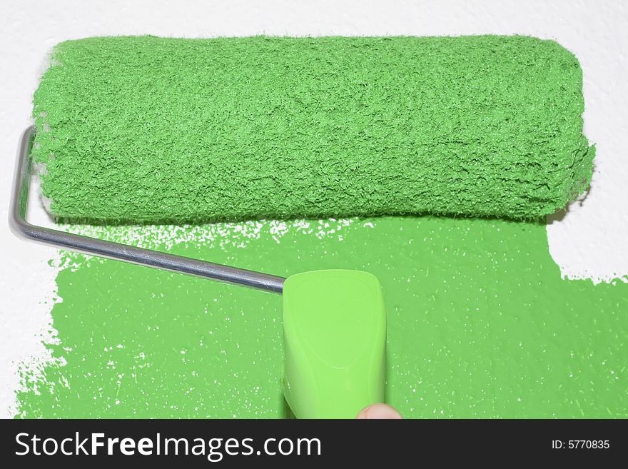 Green roller coloring white surface