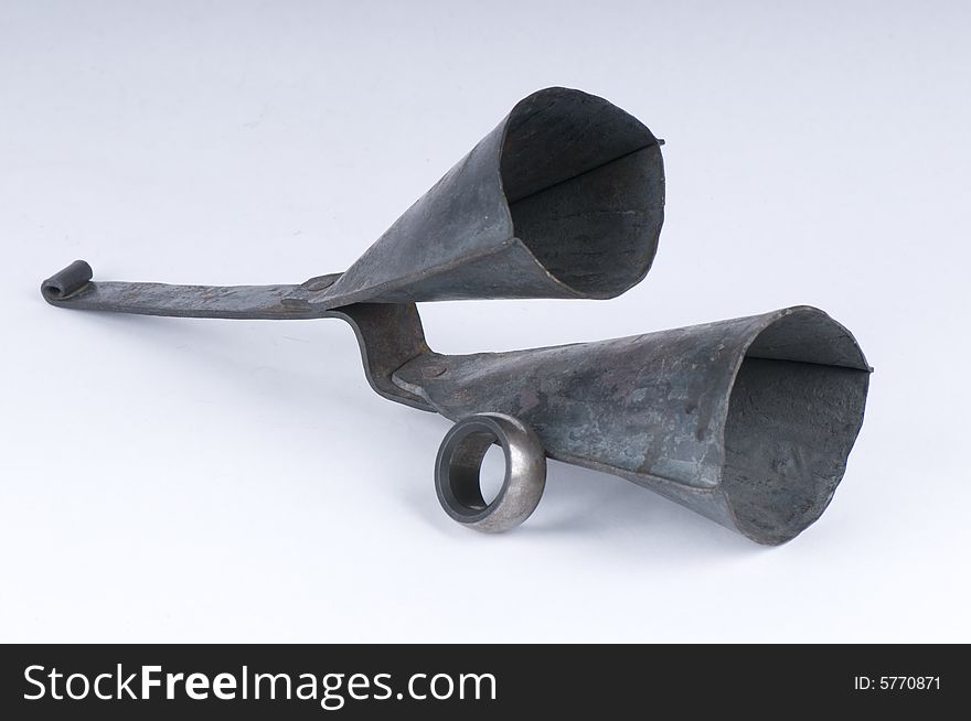 A hand crafted set of iron bells used as a musical instrument for percussion. The ring is placed on the thumb and used to tap the pod producing a clangy sound. A hand crafted set of iron bells used as a musical instrument for percussion. The ring is placed on the thumb and used to tap the pod producing a clangy sound