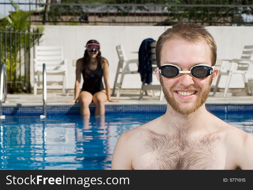 Man and Woman Sitting in Pool - Horizontal