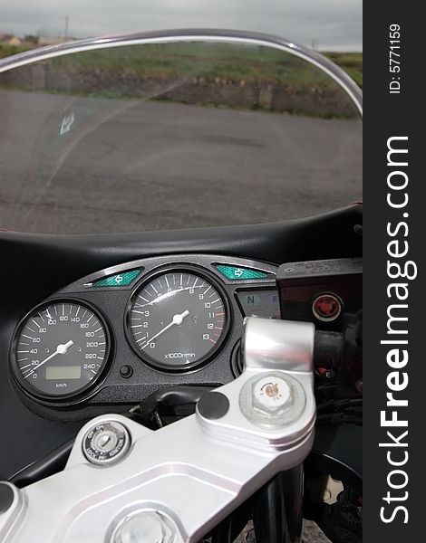 Beautiful closeup of a generic front end of a motorcycle dashboard. Beautiful closeup of a generic front end of a motorcycle dashboard