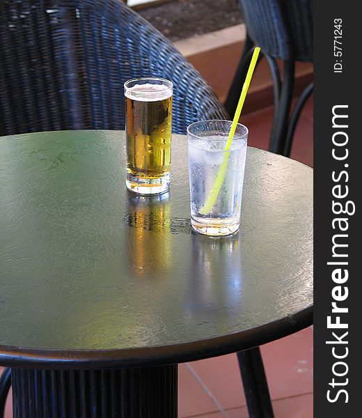 Drinks on a black outdoor table. Drinks on a black outdoor table
