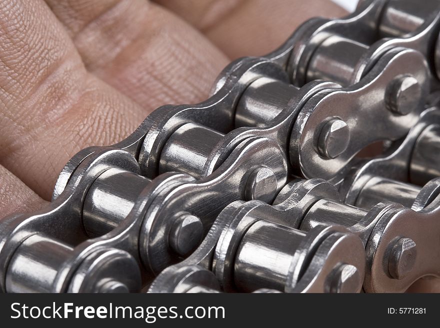 Close up of hand with metal link chain