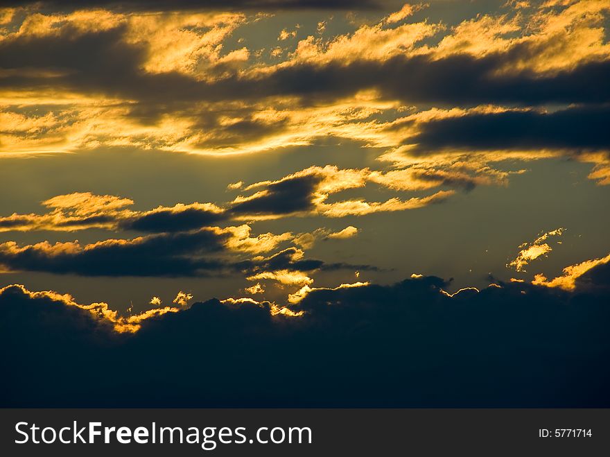 Sunset sky with dark clouds. Sunset sky with dark clouds
