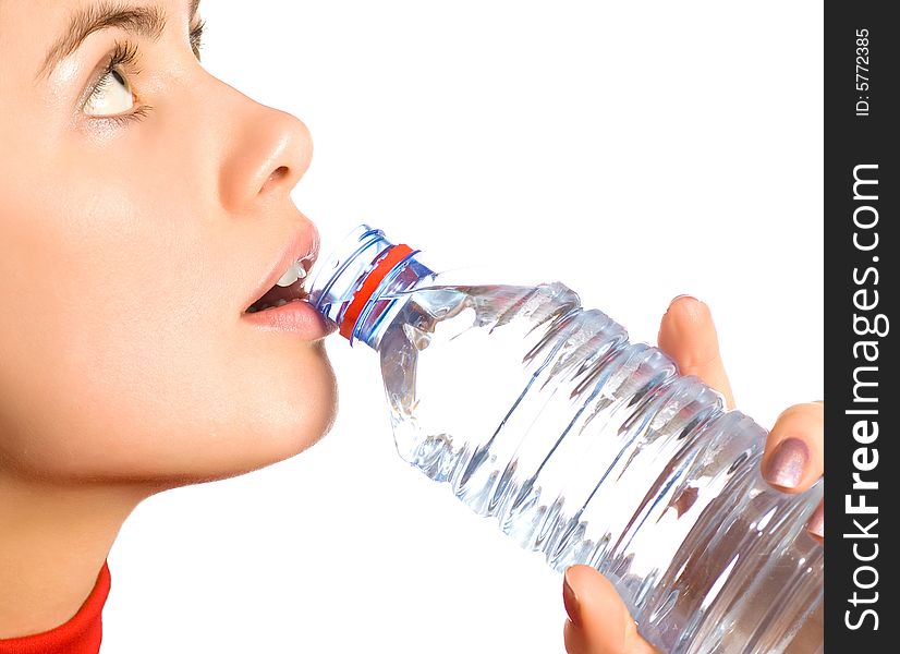 Young  girl with mineral water (isolated on white). Young  girl with mineral water (isolated on white)