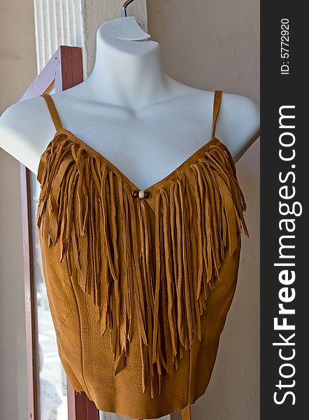Mannequins in Western style suede apparel