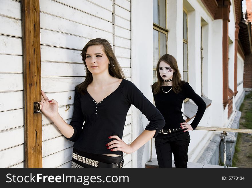 Two Teenagers Against Wooden Wall