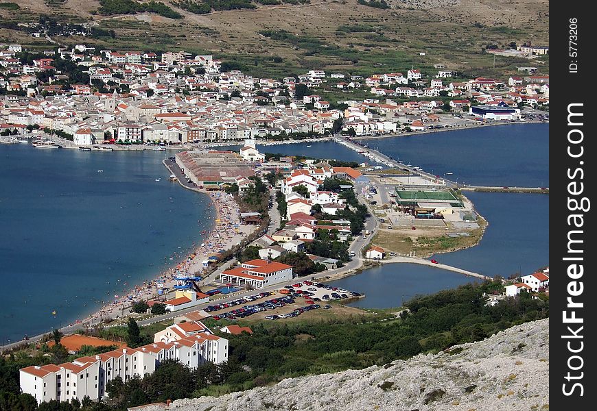 Mediterranian village in a picturesque harbour surrounded by rocky hills