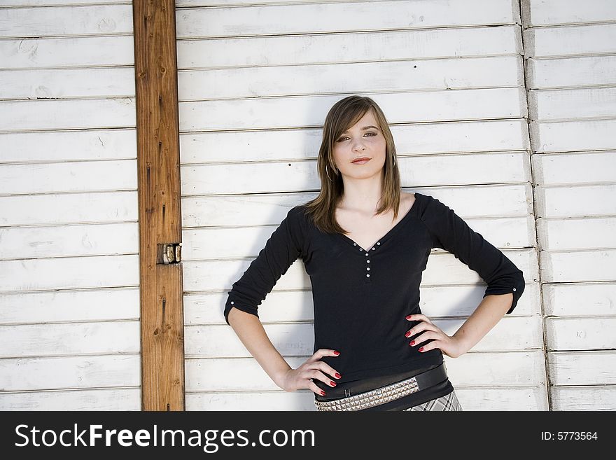 Beauty Girl Portrait On The Wooden Background