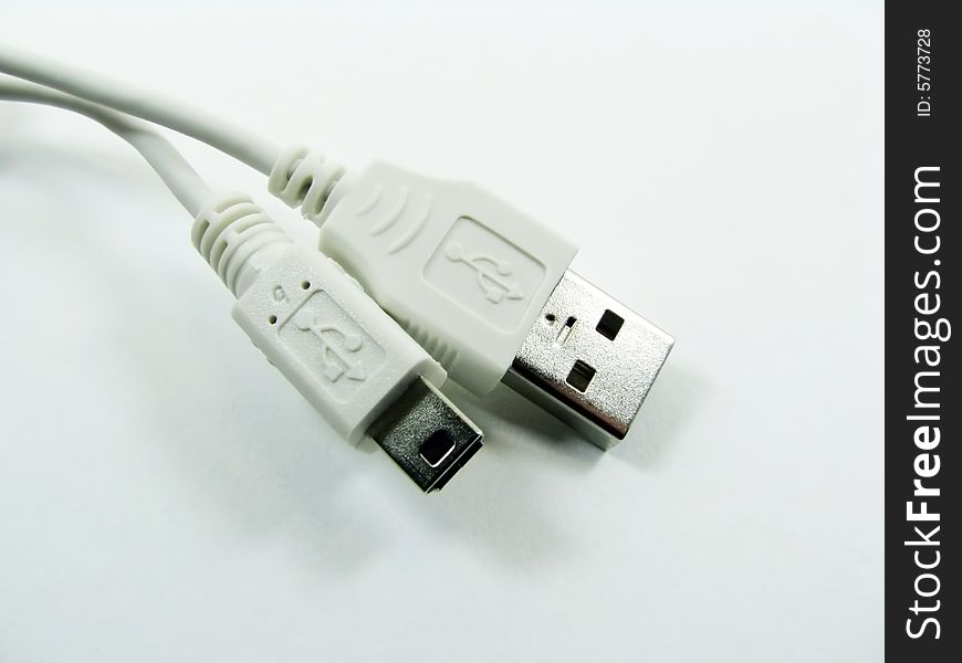 A white usb computer cable. A white usb computer cable.