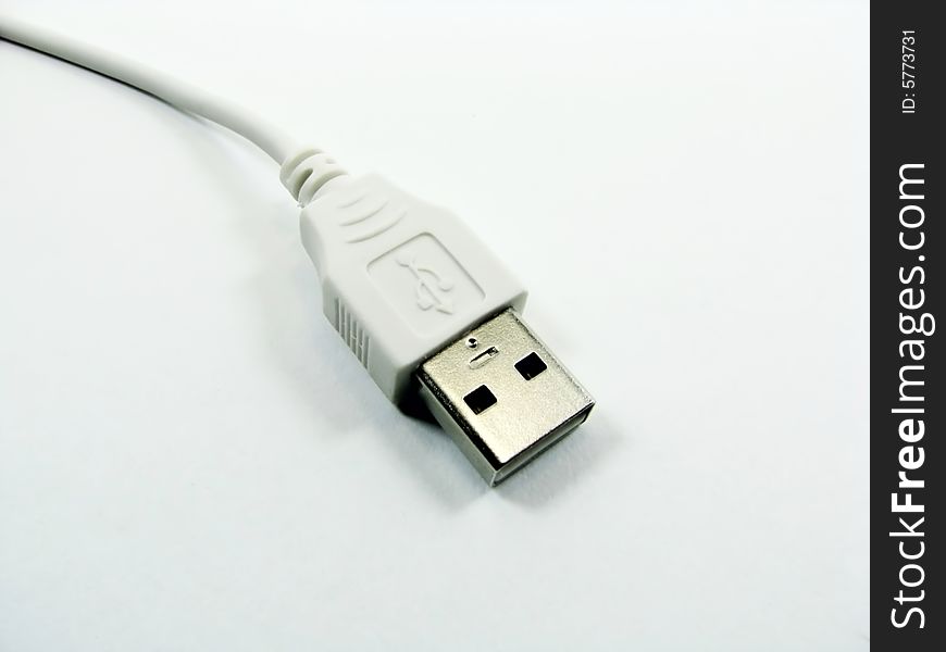 A white usb computer cable. A white usb computer cable.