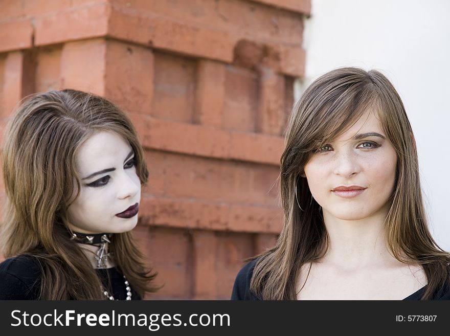 Teenagers Portrait On The Brick Background