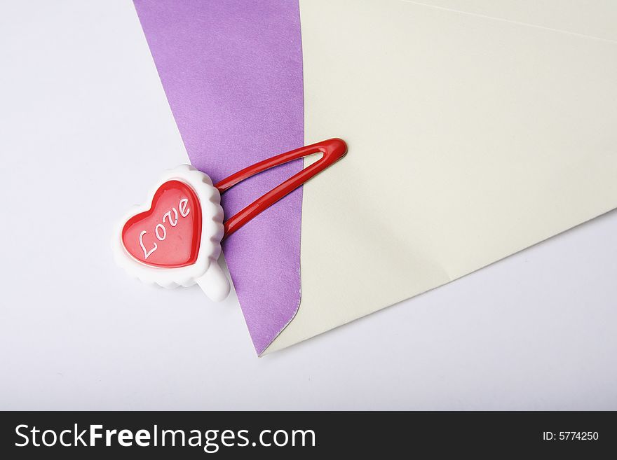 'love' on red heart shape clip with envelope. 'love' on red heart shape clip with envelope