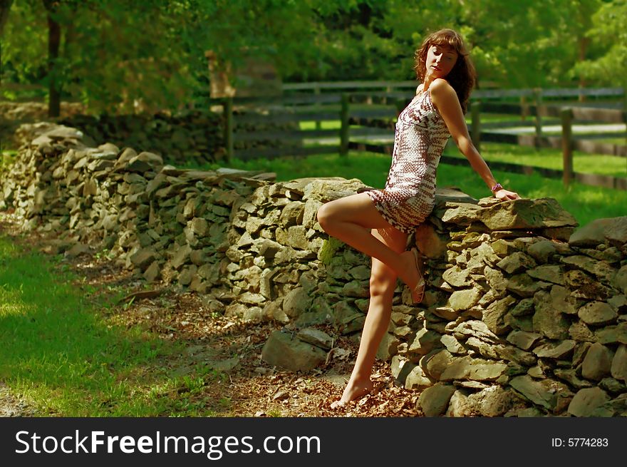 Beautiful woman lounging in the countryside. Beautiful woman lounging in the countryside.