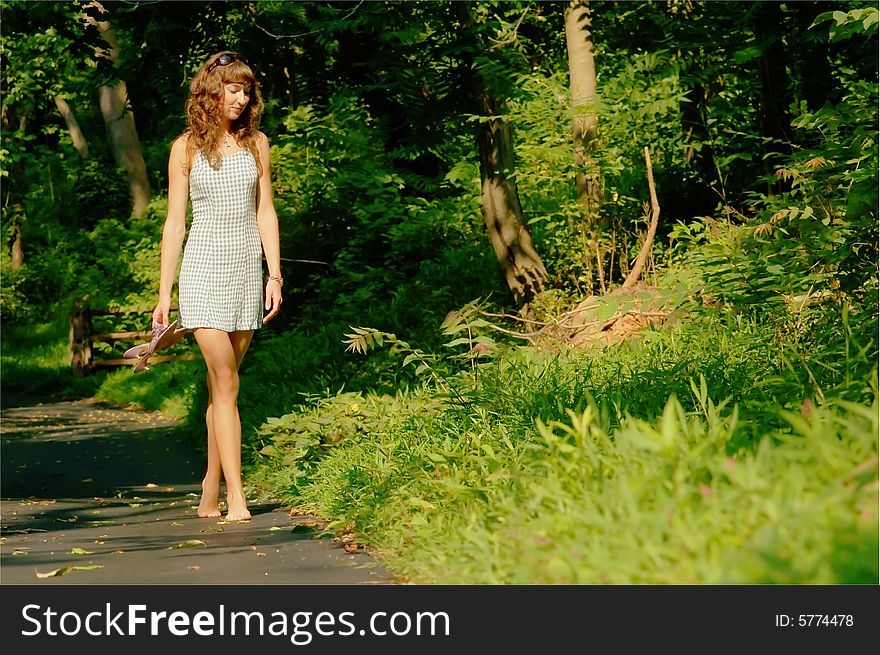 Pretty girl on forested pathway. Pretty girl on forested pathway.