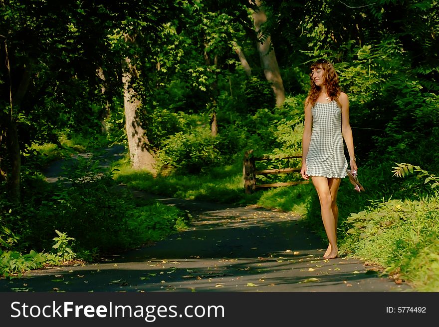 Pretty girl on forested pathway. Pretty girl on forested pathway.