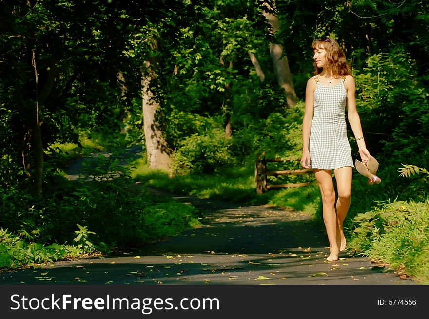 Pretty girl on forest path